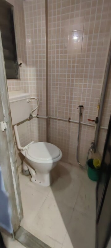 Bathroom in 1 BHK Apartment at Nirman Ramchandra Bhagat CHS, Dombivli West – for Sale