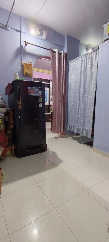 Living Room in 1 BHK Apartment at Nirman Ramchandra Bhagat CHS, Dombivli West – for Sale