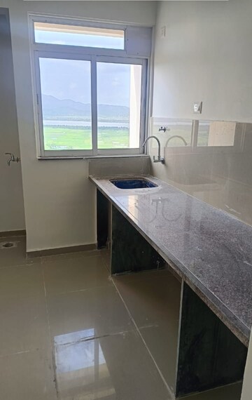 Kitchen in 1 BHK Apartment at Puraniks City Reserva, Ghodbunder Road – for Sale