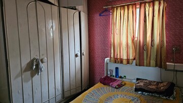 Bedroom in 2 BHK Apartment at Gokuldham Brindavan CHS, Vrindavan Society – for Sale