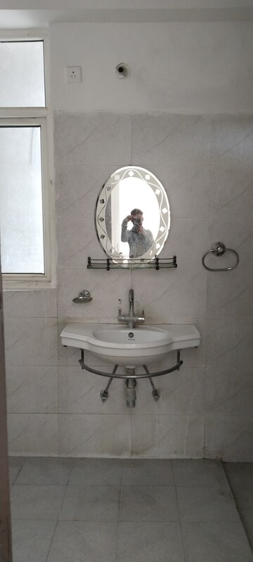 Bathroom in 2 BHK Apartment at Ramprastha Greens Pearl Court, Shahpur Bamheta – for Rent