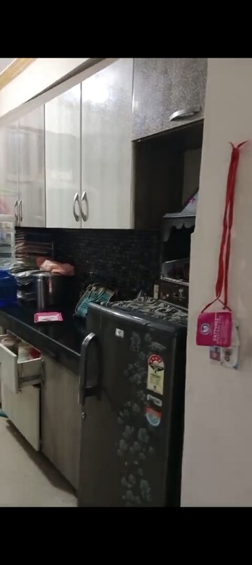 Kitchen in 2 BHK Apartment at Paramount Symphony, Sain Vihar – for Sale