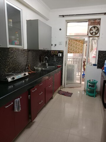 Kitchen in 2.5 BHK Apartment at Paramount Symphony, Sain Vihar – for Sale