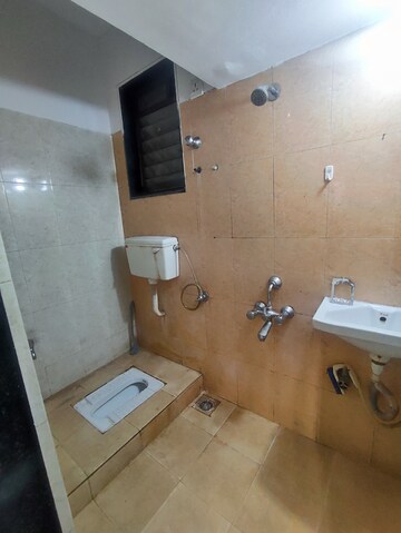 Bathroom in 1 BHK Apartment at Raunak Unnathi Greens, Kasarvadavali – for Sale