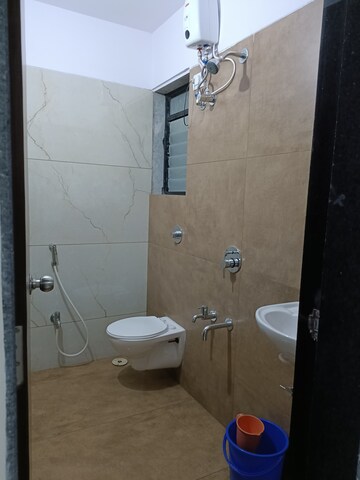 Bathroom in 1 BHK Apartment at Raunak Unnathi Woods Phase 7 A And B, Ghodbunder Road – for Sale