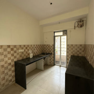 Living Room in 2 BHK Apartment at Divine Aspen Garden, Sonawala Industry Estate – for Sale