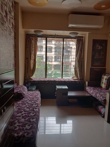 Living Room in 1 BHK Apartment at Kopar Khairane – for Sale