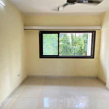 Room in 2 BHK Apartment at Swapna Mahal CHS, Veena Nagar Phase 2 – for Sale