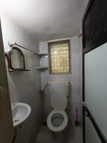 Bathroom in 1 RK Apartment at Om Krishna CHS, Dahisar East – for Sale