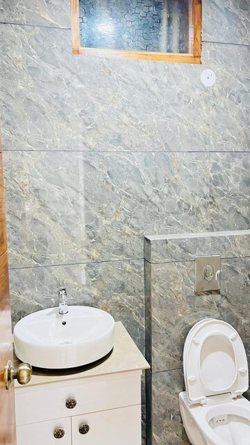Bathroom in 3 BHK Apartment at Charms Castle, Raj Nagar Extension – for Sale