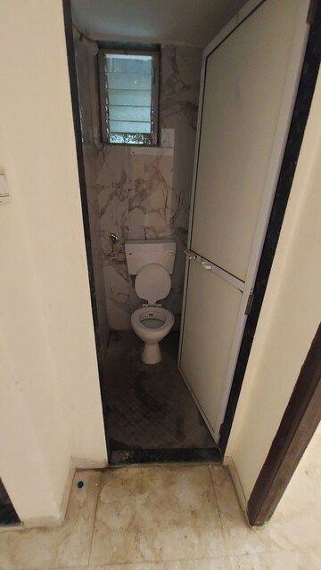Bathroom in 1 BHK Apartment at Mohan Tulsi Vihar, Badlapur West – for Sale