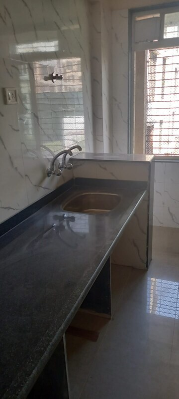 Kitchen in 1 BHK Apartment at Mohan Suburbia, Ambernath West – for Sale