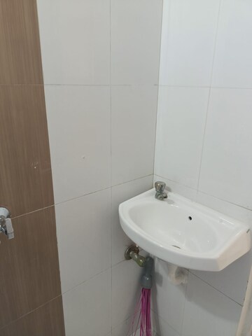 Bathroom in 2 BHK Apartment at Unnati Woods CHS, Kasarvadavali – for Sale