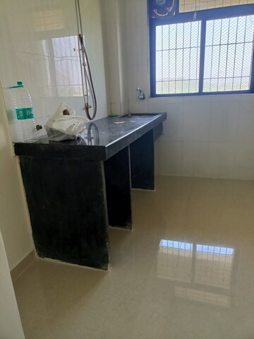 Kitchen in 2 BHK Apartment at Unnati Woods CHS, Kasarvadavali – for Sale