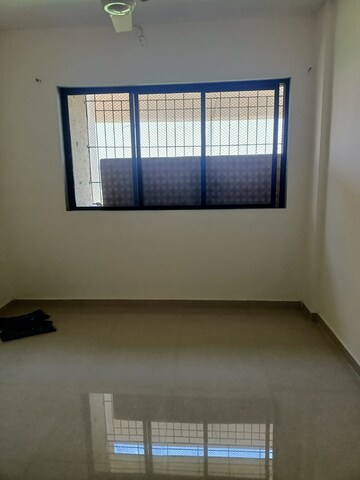 Room in 2 BHK Apartment at Unnati Woods CHS, Kasarvadavali – for Sale