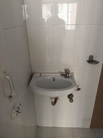 Bathroom in 2 BHK Apartment at Unnati Woods CHS, Kasarvadavali – for Sale
