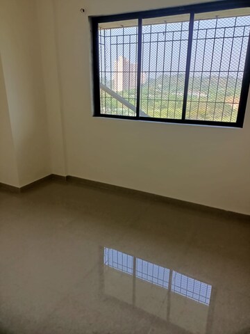 Room in 2 BHK Apartment at Unnati Woods CHS, Kasarvadavali – for Sale