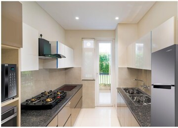 Kitchen in 4 BHK Apartment at Motia Blue Ridge, Dhakoli Village – for Sale