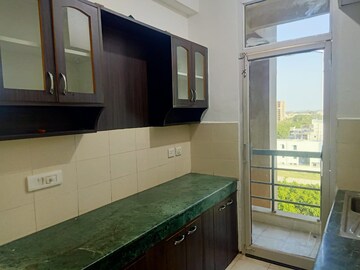 Kitchen in 2 BHK Apartment at Ansal Sushant Golf city, Sushant Golf City – for Sale