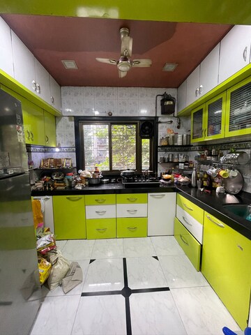 Kitchen in 2 BHK Apartment at Raj Shiv CHS, Dahisar East – for Sale