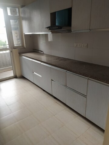 Kitchen in 3 BHK Apartment at DLF Regal Gardens, Sector 90 – for Rent