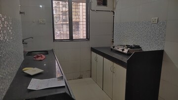 Kitchen in 1 BHK Apartment at Sethia Green View, Goregaon West – for Sale