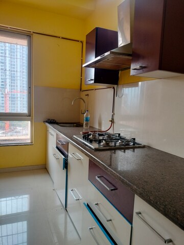 Kitchen in 1 BHK Apartment at Puranik Rumah Bali, Ghodbunder Road – for Sale