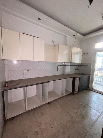 Kitchen in 3.5 BHK Apartment at Rani Aakriti Shantiniketan, Sector 143 – for Sale