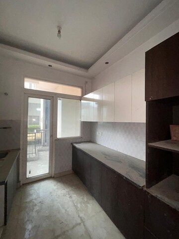 Kitchen in 3.5 BHK Apartment at Rani Aakriti Shantiniketan, Sector 143 – for Sale