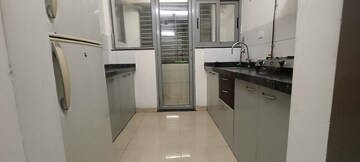 Kitchen in 1.5 BHK Apartment at Amanora Future Towers, Hadapsar – for Sale