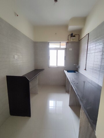 Kitchen in 2 BHK Apartment at Vihang Valley Phase 3, Kasarvadavali – for Sale