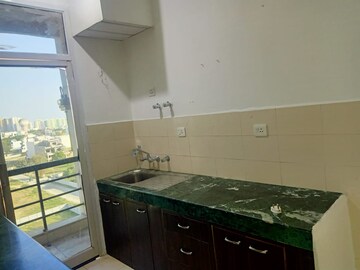 Kitchen in 2 BHK Apartment at Ansal Sushant Golf city, Sushant Golf City – for Sale