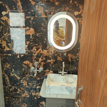 Bathroom in Studio Apartment at Emaar Palm Select, Sector 77 – for Sale