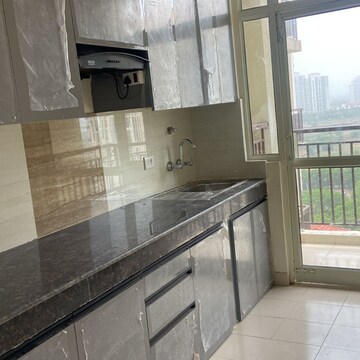 Kitchen in 3 BHK Apartment at DLF The Skycourt, Nawada Fatehpur – for Sale