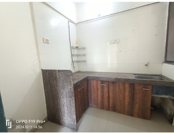 Kitchen in 2 BHK Apartment at Yashraj Park CHS, Kasarvadavali – for Sale
