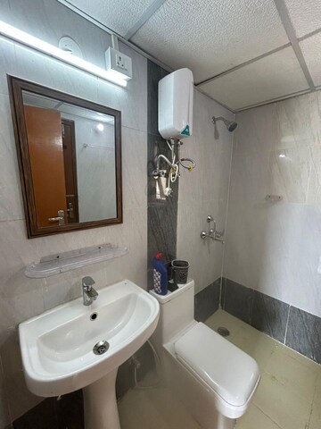 Bathroom in 2 BHK Apartment at Shri Radha Aqua Garden, Sector 16b Greater Noida – for Sale