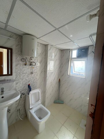 Bathroom in 2 BHK Apartment at Shri Radha Aqua Garden, Sector 16b Greater Noida – for Sale