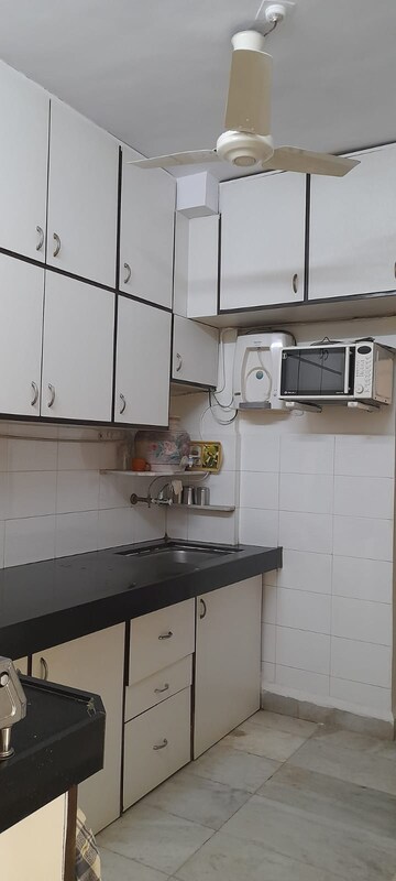 Kitchen in 3 BHK Apartment at Gundecha Marigold, Kandivali East – for Sale