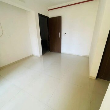 Living Room in 1 BHK Apartment at Vastusankalp Punyodaya Rio, Kalyan West – for Sale