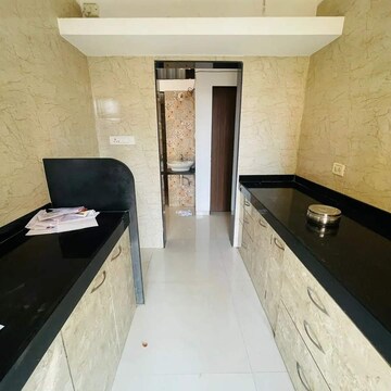 Kitchen in 1 BHK Apartment at Vastusankalp Punyodaya Rio, Kalyan West – for Sale