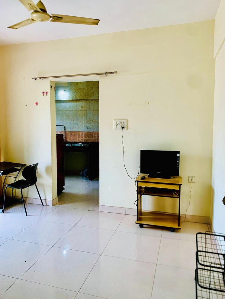 Living Room, magarpatta-city-zinnia 1 Bedroom 560 Sq.Ft. Apartment In Hadapsar Pune 7813559