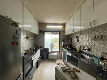 Kitchen in 1.5 BHK Apartment at Cosmos Tower, Majiwada – for Sale