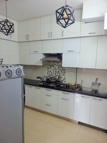 Kitchen in 3 BHK Apartment at Purvanchal Royal City, Chi V Greater Noida – for Sale