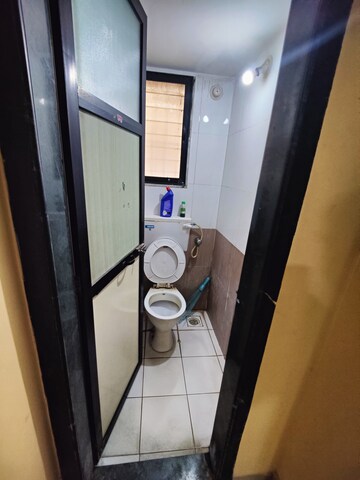 Bathroom in 1 BHK Apartment at Raunak Unnathi Woods Phase 4 And 5, Ghodbunder Road – for Sale