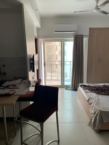 Living Room in Studio Apartment at Nimbus The Golden Palm, Sector 168 – for Sale