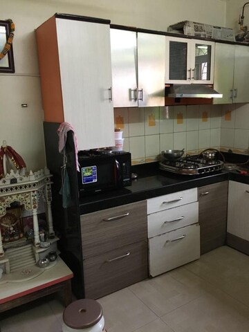 Kitchen in 2 BHK Apartment at Shreya Anand CHS Ltd, Dhokali – for Sale
