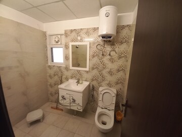 Bathroom in 3.5 BHK Apartment at Elite Golf Green, Sector 79 – for Sale