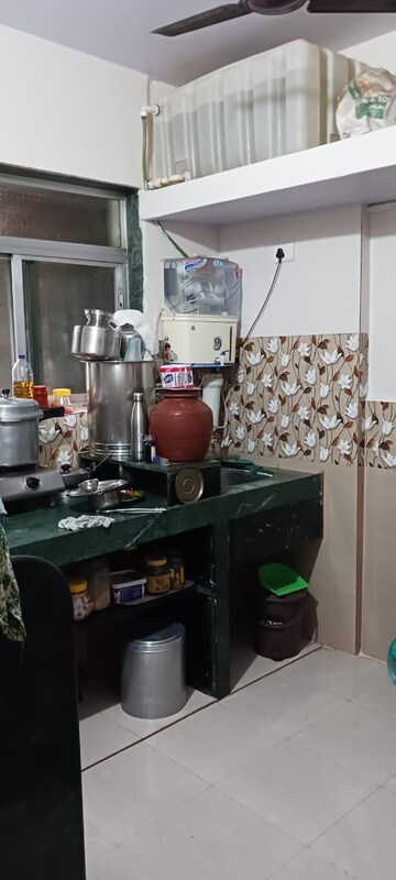 Kitchen in 1 BHK Apartment at Raj Dharm CHS, Dombivli West – for Sale