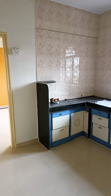 Kitchen in 1 BHK Apartment at Raj Dharm CHS, Dombivli West – for Sale