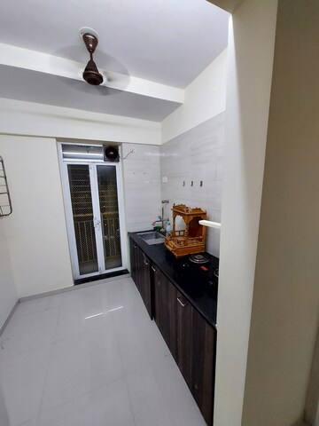Kitchen in 1 BHK Apartment at Kishor Sukur Enclave A, Ghodbunder Road – for Sale